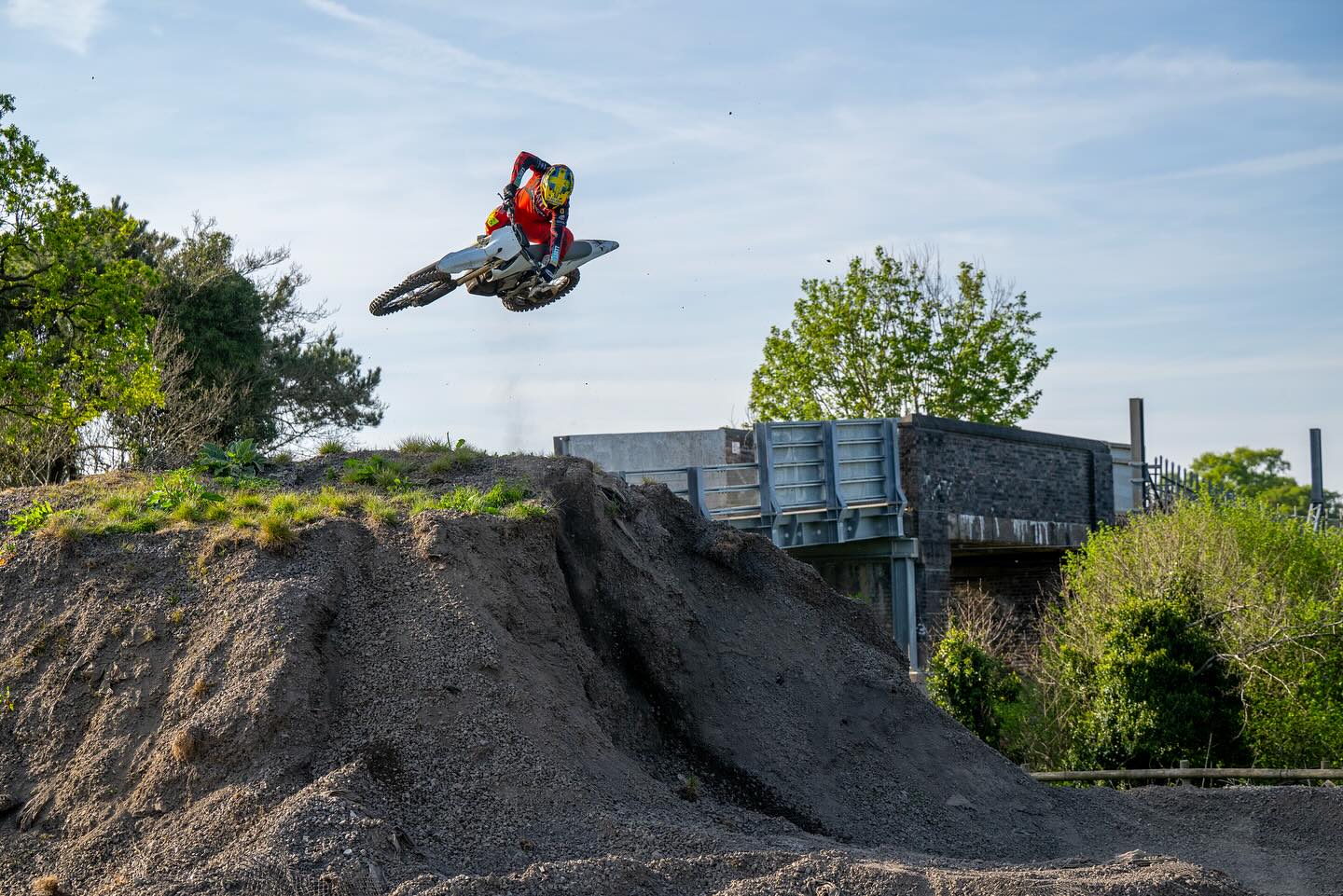 Rider jumps electric bike over a hill